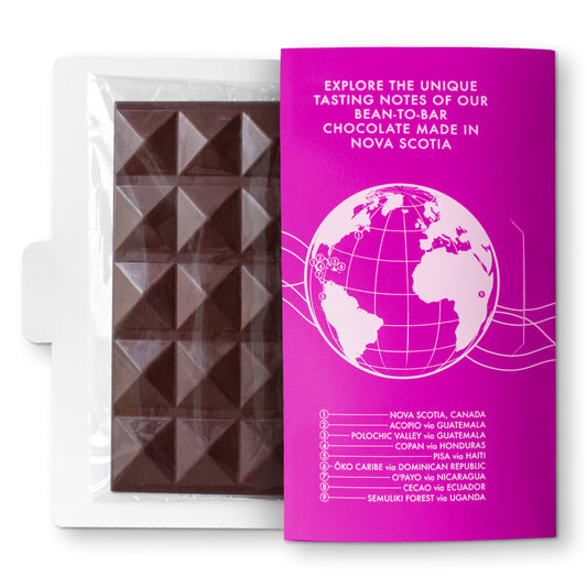 A chocolate bar with a pink and white packaging, displaying a globe graphic and text, including the brand name 'Evertide'.