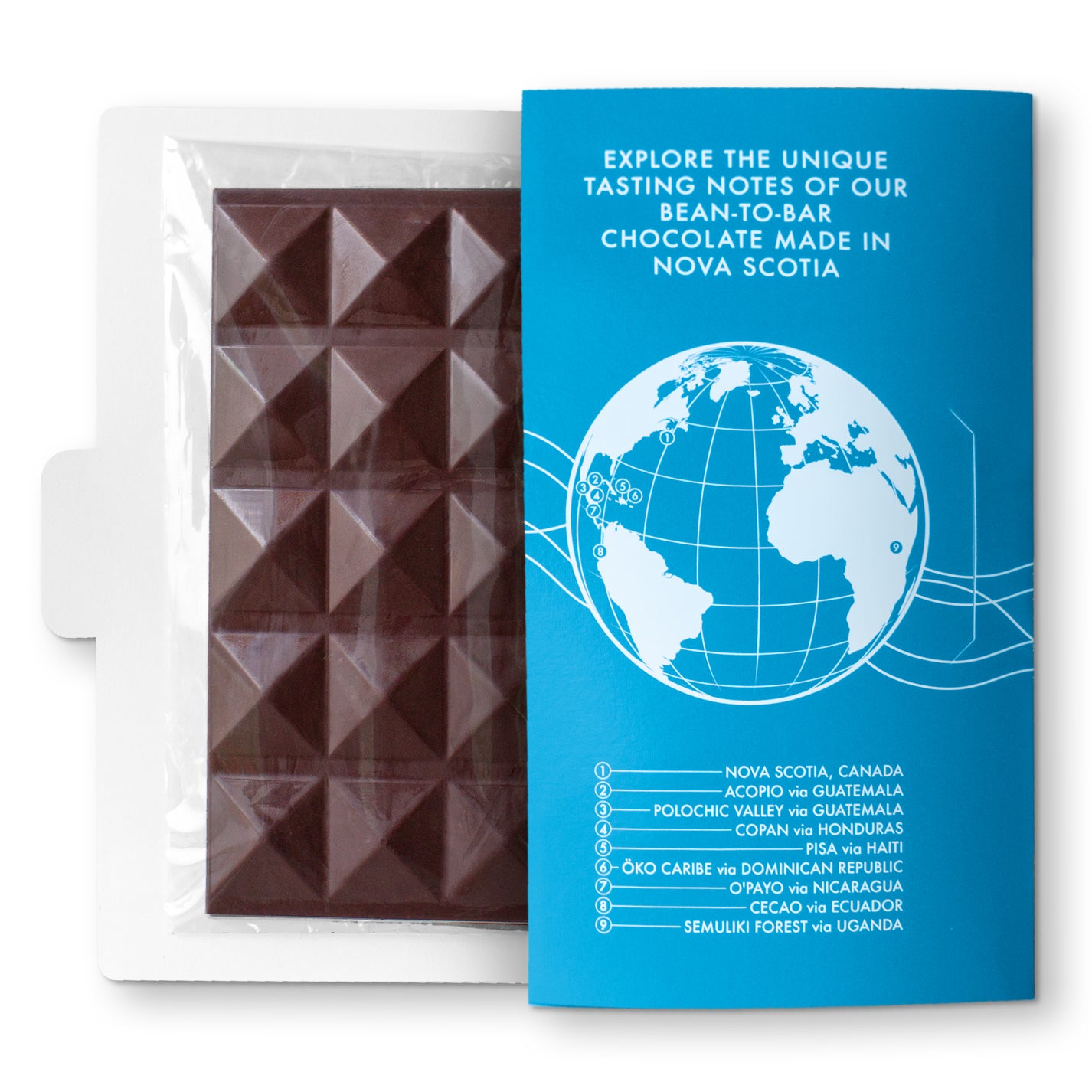 A chocolate bar with sea salt and nibs on back, presented in a light blue wrapper with a globe graphic and text.